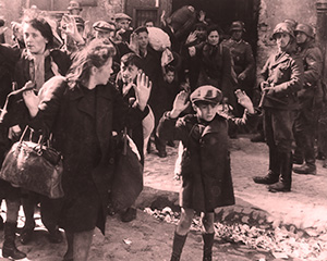 Polish Jewish resistance fighters, including women and children, finally surrender to the Nazis at the end of the Warsaw ghetto uprising in April and May of 1943.