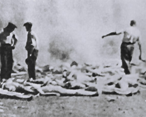 The bodies of gassed Jewish people are shown being burned in open pits at Auschwitz in 1944.