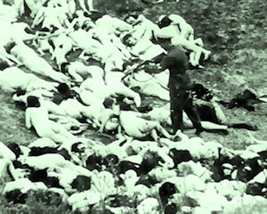 A Nazi Einsatzgruppen executioner finishes off a dying Jewish woman during a massacre of Jews in Ukraine in 1942.